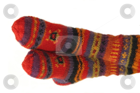 To use this stock image in your creative project, please select the size you need over to the right and click the "Add to Cart" button.
Your downloaded image will come with the Cutcaster watermark removed so don’t worry about the watermark you see on this page. Warm Feet stock photo, Warm feet covered in brightly colored wool socks. by Great Divide Photography
