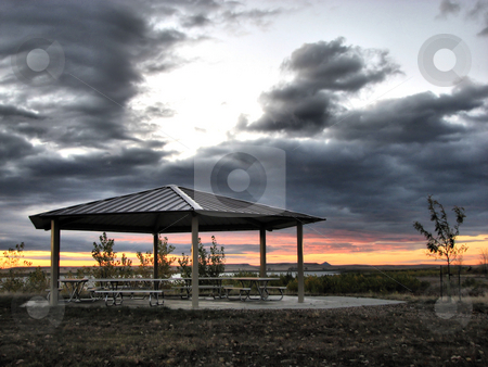 To use this stock image in your creative project, please select the size you need over to the right and click the "Add to Cart" button.
Your downloaded image will come with the Cutcaster watermark removed so don’t worry about the watermark you see on this page. Picnic Shelter At Sunrise stock photo, Taken At The Orman Dam In South Dakota by Brian Meyer