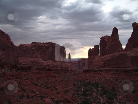 To use this stock image in your creative project, please select the size you need over to the right and click the "Add to Cart" button.
Your downloaded image will come with the Cutcaster watermark removed so don’t worry about the watermark you see on this page. Arches National Park at stormy sunset stock photo, Taken near to the Park entrance as a storm rolled in. by JKJ Anderson