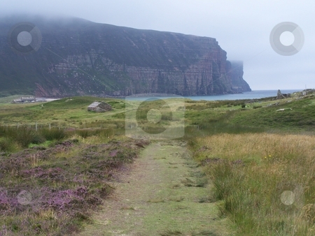To use this stock image in your creative project, please select the size you need over to the right and click the "Add to Cart" button.
Your downloaded image will come with the Cutcaster watermark removed so don’t worry about the watermark you see on this page. Rackwick Bay and cliffs on Hoy, Orkneys stock photo, Approaching Rackwick Bay after hiking across the Island of Hoy, Orkneys. by JKJ Anderson
