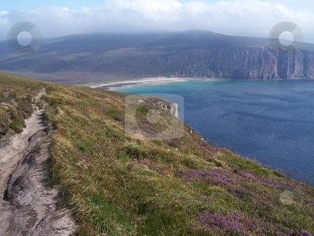To use this stock image in your creative project, please select the size you need over to the right and click the "Add to Cart" button.
Your downloaded image will come with the Cutcaster watermark removed so don’t worry about the watermark you see on this page. Looking down at Rackwick Bay, Orkney stock photo, Returning to Rackwick Bay from hiking to the Old Man of Hoy, Orkney Islands. by JKJ Anderson