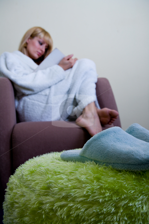 To use this stock image in your creative project, please select the size you need over to the right and click the "Add to Cart" button.
Your downloaded image will come with the Cutcaster watermark removed so don’t worry about the watermark you see on this page. Morning slippers in front of reading woman stock photo, Blond model by Frenk and Danielle Kaufmann