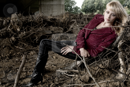 To use this stock image in your creative project, please select the size you need over to the right and click the "Add to Cart" button.
Your downloaded image will come with the Cutcaster watermark removed so don’t worry about the watermark you see on this page. Laying between dead trees stock photo, Fashion shoot under a bridge by Frenk and Danielle Kaufmann
