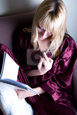 To use this stock image in your creative project, please select the size you need over to the right and click the "Add to Cart" button.
Your downloaded image will come with the Cutcaster watermark removed so don’t worry about the watermark you see on this page. Reading a book and playing her hair stock photo, Playing with her hair while reading a book by Frenk and Danielle Kaufmann