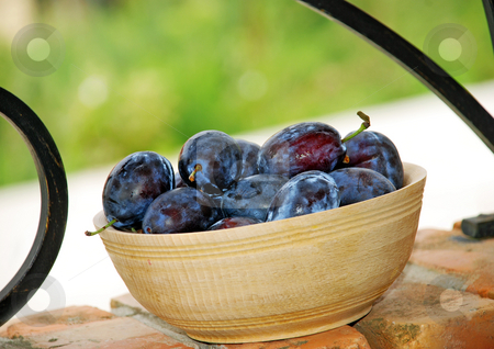 To use this stock image in your creative project, please select the size you need over to the right and click the "Add to Cart" button.
Your downloaded image will come with the Cutcaster watermark removed so don’t worry about the watermark you see on this page. Plums wooden bowl stock photo, Blue ripe plums in wooden bowl over brick fence by Julija Sapic