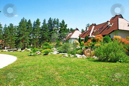 To use this stock image in your creative project, please select the size you need over to the right and click the "Add to Cart" button.
Your downloaded image will come with the Cutcaster watermark removed so don’t worry about the watermark you see on this page. Cottage village stock photo, Weekend mountain houses green grass in Serbia, Zlatibor by Julija Sapic