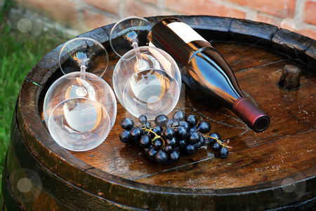 To use this stock image in your creative project, please select the size you need over to the right and click the "Add to Cart" button.
Your downloaded image will come with the Cutcaster watermark removed so don’t worry about the watermark you see on this page. Wood Wine barrel stock photo, Glasses and bottle of wine lying over wooden barrel by Julija Sapic