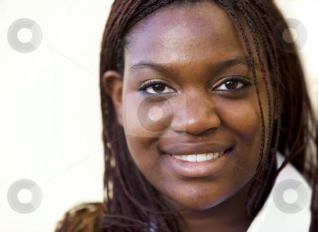 To use this stock image in your creative project, please select the size you need over to the right and click the "Add to Cart" button.
Your downloaded image will come with the Cutcaster watermark removed so don’t worry about the watermark you see on this page. African American Woman stock photo, Closeup of a pretty African American woman with braids by Scott Griessel