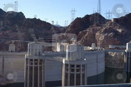 To use this stock image in your creative project, please select the size you need over to the right and click the "Add to Cart" button.
Your downloaded image will come with the Cutcaster watermark removed so don’t worry about the watermark you see on this page. Lake Mead Side of Hoover Dam stock photo, Built on the Colorado River and the border of Arizona and Nevada, the Hoover Dam is a prime example of a man-made wonder. This view from the east side, above the dam, shows some of the electrical generating structures. It took four years to build the Hoover Dam between 1931-1935. by Dennis Thomsen