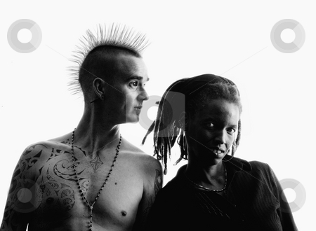 To use this stock image in your creative project, please select the size you need over to the right and click the "Add to Cart" button.
Your downloaded image will come with the Cutcaster watermark removed so don’t worry about the watermark you see on this page. Man and Woman stock photo, Man with Mohawk and Woman wearing Dreadlocks by Scott Griessel