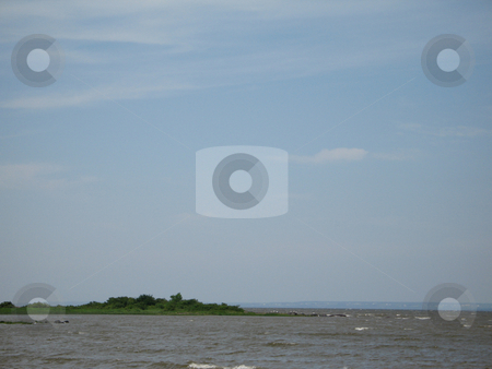 To use this stock image in your creative project, please select the size you need over to the right and click the "Add to Cart" button.
Your downloaded image will come with the Cutcaster watermark removed so don’t worry about the watermark you see on this page. Island in the middle of the river stock photo, Island in the middle of the river by Mbudley Mbudley