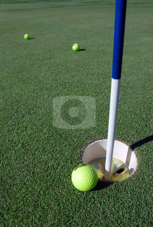 To use this stock image in your creative project, please select the size you need over to the right and click the "Add to Cart" button.
Your downloaded image will come with the Cutcaster watermark removed so don’t worry about the watermark you see on this page. Golf Hole and ball stock photo, by Brian Shephard