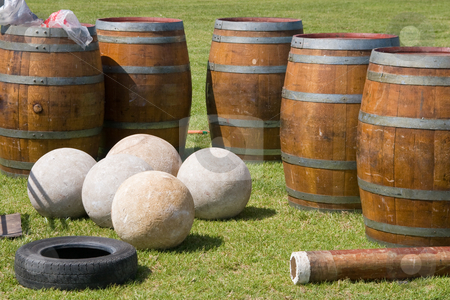 To use this stock image in your creative project, please select the size you need over to the right and click the "Add to Cart" button.
Your downloaded image will come with the Cutcaster watermark removed so don’t worry about the watermark you see on this page. Highland Games Equipment stock photo, Scottish highland games stones and barrels by Nicholas Rjabow