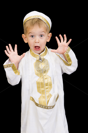 To use this stock image in your creative project, please select the size you need over to the right and click the "Add to Cart" button.
Your downloaded image will come with the Cutcaster watermark removed so don’t worry about the watermark you see on this page. Adorable kid with facial expression stock photo, An adorable little boy dressed in Arabian thobe, isolated on black. by Nicolaas Traut