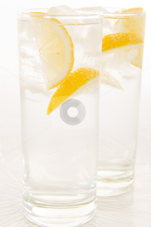 To use this stock image in your creative project, please select the size you need over to the right and click the "Add to Cart" button.
Your downloaded image will come with the Cutcaster watermark removed so don’t worry about the watermark you see on this page. Water with fresh lemon stock photo, Sparkling water with slices of fresh lemon and lime on a white background. by Nicolaas Traut