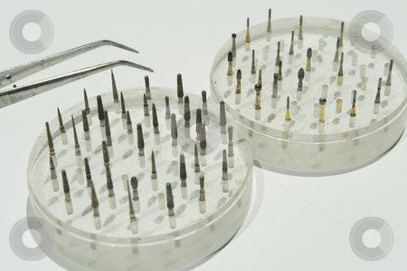 To use this stock image in your creative project, please select the size you need over to the right and click the "Add to Cart" button.
Your downloaded image will come with the Cutcaster watermark removed so don’t worry about the watermark you see on this page. Dentistry instruments stock photo, A variety of dentistry drillbits in their holders, with a pair of tweezers. by Nicolaas Traut
