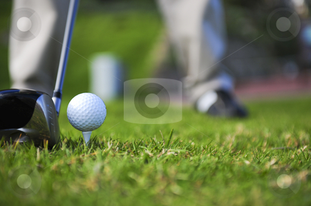 To use this stock image in your creative project, please select the size you need over to the right and click the "Add to Cart" button.
Your downloaded image will come with the Cutcaster watermark removed so don’t worry about the watermark you see on this page. Golfer in action stock photo, A golfer in action on a practice range, lining up his driving wood with a ball on a tee. by Nicolaas Traut