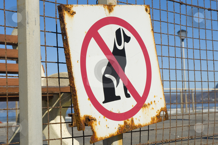 To use this stock image in your creative project, please select the size you need over to the right and click the "Add to Cart" button.
Your downloaded image will come with the Cutcaster watermark removed so don’t worry about the watermark you see on this page. No dogs allowed stock photo, An old rusty sign, indicating that no dogs are allowed on the beach. by Nicolaas Traut