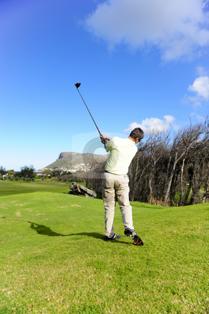 To use this stock image in your creative project, please select the size you need over to the right and click the "Add to Cart" button.
Your downloaded image will come with the Cutcaster watermark removed so don’t worry about the watermark you see on this page. Handsome young golfer in action stock photo, A golfer in action on a practice range, hitting the ball with a club. by Nicolaas Traut