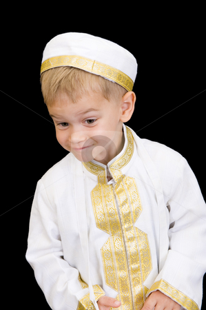 To use this stock image in your creative project, please select the size you need over to the right and click the "Add to Cart" button.
Your downloaded image will come with the Cutcaster watermark removed so don’t worry about the watermark you see on this page. Adorable kid with facial expression stock photo, An adorable little boy dressed in Arabian thobe, isolated on black. by Nicolaas Traut