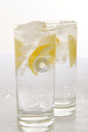 To use this stock image in your creative project, please select the size you need over to the right and click the "Add to Cart" button.
Your downloaded image will come with the Cutcaster watermark removed so don’t worry about the watermark you see on this page. Water with fresh lemon stock photo, Sparkling water with slices of fresh lemon and lime on a white background. by Nicolaas Traut