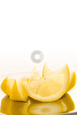 To use this stock image in your creative project, please select the size you need over to the right and click the "Add to Cart" button.
Your downloaded image will come with the Cutcaster watermark removed so don’t worry about the watermark you see on this page. Fresh sliced lemon stock photo, Freshly cut slices of lemon on a shiny plate with a white background. by Nicolaas Traut