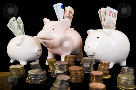To use this stock image in your creative project, please select the size you need over to the right and click the "Add to Cart" button.
Your downloaded image will come with the Cutcaster watermark removed so don’t worry about the watermark you see on this page. Piggybank with various currency stock photo, Piggybank with various international currencies on a black background. Three pigs are showing the 3 major international currencies, Dollar, Euro and Pound Stirling. Dollar is in the smaller pig conceptualizing the weak currency. by Nicolaas Traut