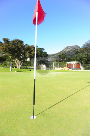 To use this stock image in your creative project, please select the size you need over to the right and click the "Add to Cart" button.
Your downloaded image will come with the Cutcaster watermark removed so don’t worry about the watermark you see on this page. Golfer playing out of a sand trap stock photo, A professional golfer playing a shot out of a sand-trap with excellent control towards the flag. by Nicolaas Traut