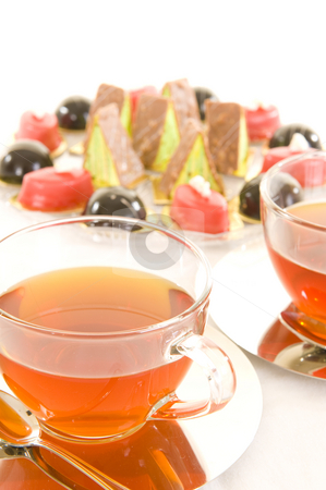 To use this stock image in your creative project, please select the size you need over to the right and click the "Add to Cart" button.
Your downloaded image will come with the Cutcaster watermark removed so don’t worry about the watermark you see on this page. Tea and confectionery stock photo, Freshly brewed red tea in a glass cup on a shiny saucer, with some colorful confectionery on a white background. by Nicolaas Traut