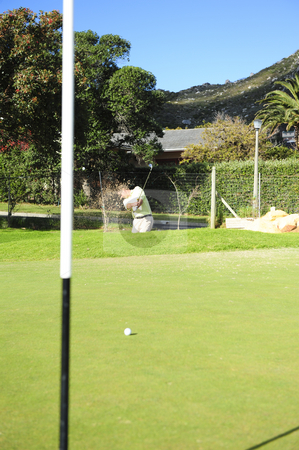 To use this stock image in your creative project, please select the size you need over to the right and click the "Add to Cart" button.
Your downloaded image will come with the Cutcaster watermark removed so don’t worry about the watermark you see on this page. Golfer playing out of a sand trap stock photo, A professional golfer playing a shot out of a sand-trap with excellent control towards the flag. by Nicolaas Traut