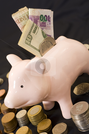 To use this stock image in your creative project, please select the size you need over to the right and click the "Add to Cart" button.
Your downloaded image will come with the Cutcaster watermark removed so don’t worry about the watermark you see on this page. Piggybank with various currency stock photo, Piggybank with various international currencies on a black background. by Nicolaas Traut