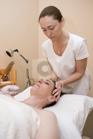 To use this stock image in your creative project, please select the size you need over to the right and click the "Add to Cart" button.
Your downloaded image will come with the Cutcaster watermark removed so don’t worry about the watermark you see on this page. Attractive lady having therapy stock photo, An attractive mature lady undergoing aromatherapy and massaging. by Nicolaas Traut