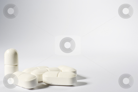 To use this stock image in your creative project, please select the size you need over to the right and click the "Add to Cart" button.
Your downloaded image will come with the Cutcaster watermark removed so don’t worry about the watermark you see on this page. Medical Pills stock photo, A group of pills on the lower left-hand side of a white frame with one standing up by Steve Smith