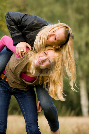To use this stock image in your creative project, please select the size you need over to the right and click the "Add to Cart" button.
Your downloaded image will come with the Cutcaster watermark removed so don’t worry about the watermark you see on this page. Falling and smiling stock photo, Two sisters in a park having fun by Frenk and Danielle Kaufmann