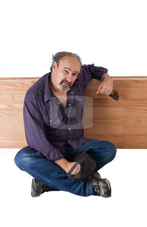 To use this stock image in your creative project, please select the size you need over to the right and click the "Add to Cart" button.
Your downloaded image will come with the Cutcaster watermark removed so don’t worry about the watermark you see on this page. Alcohol provides relief for a Homeless man stock photo, Drunk man leans on a wooden devider by RCarner Photography