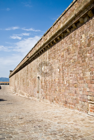 To use this stock image in your creative project, please select the size you need over to the right and click the "Add to Cart" button.
Your downloaded image will come with the Cutcaster watermark removed so don’t worry about the watermark you see on this page. Castell de montjuic stock photo, The wall of castell de montjuic by Alexander L?