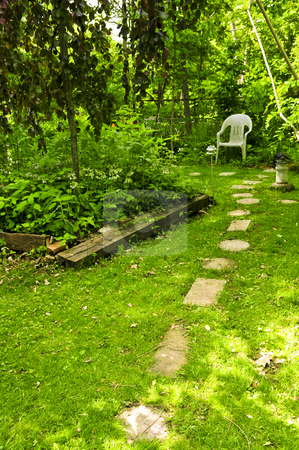 To use this stock image in your creative project, please select the size you need over to the right and click the "Add to Cart" button.
Your downloaded image will come with the Cutcaster watermark removed so don’t worry about the watermark you see on this page. Green garden stock photo, Path of stepping stones leading to secluded corner in lush green garden by Elena Elisseeva