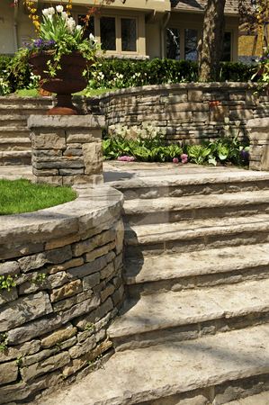 To use this stock image in your creative project, please select the size you need over to the right and click the "Add to Cart" button.
Your downloaded image will come with the Cutcaster watermark removed so don’t worry about the watermark you see on this page. Natural stone landscaping stock photo, Natural stone landscaping in front of a house by Elena Elisseeva