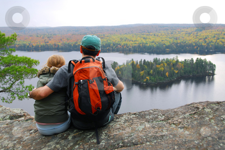 To use this stock image in your creative project, please select the size you need over to the right and click the "Add to Cart" button.
Your downloaded image will come with the Cutcaster watermark removed so don’t worry about the watermark you see on this page. Family hill top stock photo, Parent and child sitting on cliff edge enjoying scenic view by Elena Elisseeva