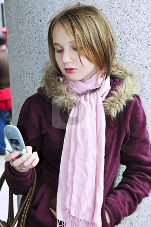 To use this stock image in your creative project, please select the size you need over to the right and click the "Add to Cart" button.
Your downloaded image will come with the Cutcaster watermark removed so don’t worry about the watermark you see on this page. Teenage girl text messaging on cell phone stock photo, Teenage girl text messaging on cell phone by Elena Elisseeva