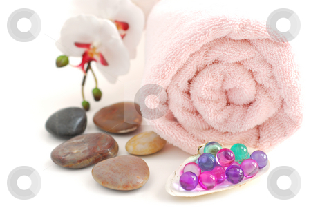 To use this stock image in your creative project, please select the size you need over to the right and click the "Add to Cart" button.
Your downloaded image will come with the Cutcaster watermark removed so don’t worry about the watermark you see on this page. Spa stock photo, Pink rolled up towel with a stack of massage stones and bath beads on white background by Elena Elisseeva