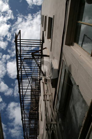 To use this stock image in your creative project, please select the size you need over to the right and click the "Add to Cart" button.
Your downloaded image will come with the Cutcaster watermark removed so don’t worry about the watermark you see on this page. Walkway stock photo, Worm's eye view of a walkway on a building by Julie Bentz