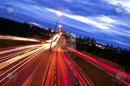 To use this stock image in your creative project, please select the size you need over to the right and click the "Add to Cart" button.
Your downloaded image will come with the Cutcaster watermark removed so don’t worry about the watermark you see on this page. Night traffic stock photo, Night traffic on a busy city highway in Toronto by Elena Elisseeva