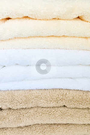 To use this stock image in your creative project, please select the size you need over to the right and click the "Add to Cart" button.
Your downloaded image will come with the Cutcaster watermark removed so don’t worry about the watermark you see on this page. Stack of towels stock photo, Background of soft stacked towels close up by Elena Elisseeva