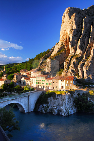 To use this stock image in your creative project, please select the size you need over to the right and click the "Add to Cart" button.
Your downloaded image will come with the Cutcaster watermark removed so don’t worry about the watermark you see on this page. Town of Sisteron in Provence France stock photo, Houses at the base of a cliff in town of Sisteron in Provence by Elena Elisseeva