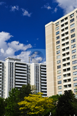 To use this stock image in your creative project, please select the size you need over to the right and click the "Add to Cart" button.
Your downloaded image will come with the Cutcaster watermark removed so don’t worry about the watermark you see on this page. Apartment buildings stock photo, Tall residential apartment buildings with blue sky by Elena Elisseeva