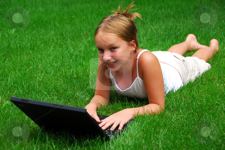 To use this stock image in your creative project, please select the size you need over to the right and click the "Add to Cart" button.
Your downloaded image will come with the Cutcaster watermark removed so don’t worry about the watermark you see on this page. Girl computer stock photo, Young girl lying on grass in a park with laptop computer by Elena Elisseeva