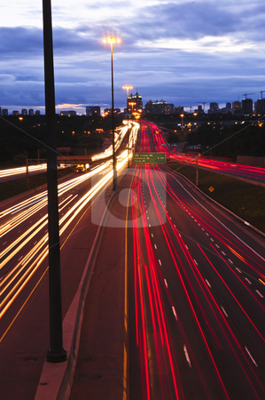 To use this stock image in your creative project, please select the size you need over to the right and click the "Add to Cart" button.
Your downloaded image will come with the Cutcaster watermark removed so don’t worry about the watermark you see on this page. Night traffic stock photo, Night traffic on a busy city highway in Toronto by Elena Elisseeva