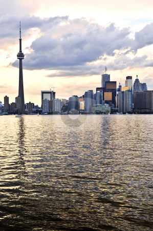 To use this stock image in your creative project, please select the size you need over to the right and click the "Add to Cart" button.
Your downloaded image will come with the Cutcaster watermark removed so don’t worry about the watermark you see on this page. Toronto skyline stock photo, Scenic view at Toronto city waterfront skyline at sunset by Elena Elisseeva