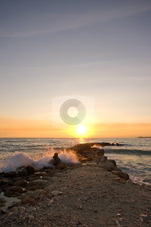 To use this stock image in your creative project, please select the size you need over to the right and click the "Add to Cart" button.
Your downloaded image will come with the Cutcaster watermark removed so don’t worry about the watermark you see on this page. Wave breaker sunset stock photo, Pastel sunset with wave breaker in front by Karin Claus